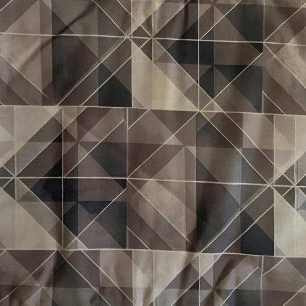 Conscious Creation: Folded Grey and White Faceted Geometric Digital Print Cotton Fabric, showing modern angular shapes, ideal for sustainable men's shirts, dresses, and contemporary home decor.