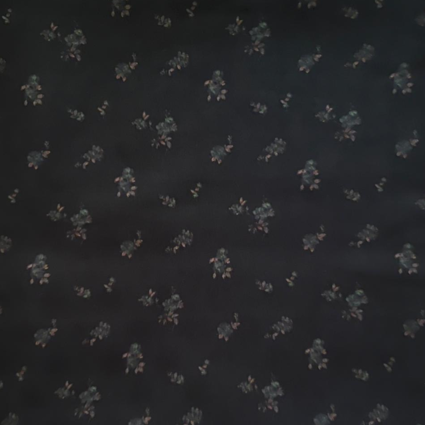 Dark fabric with small floral pattern