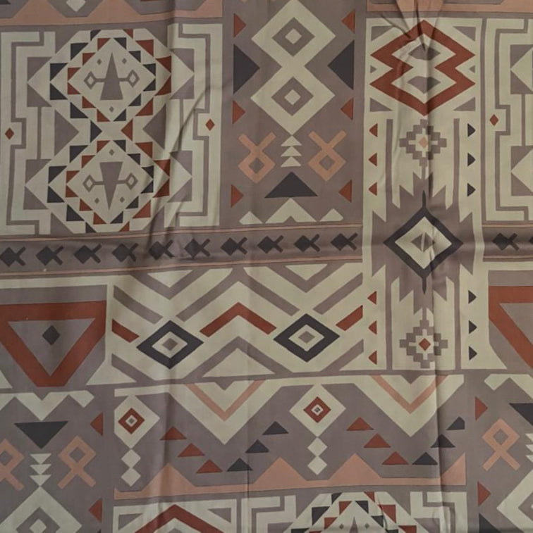 Folded Mauve and Cream Tribal Geometric Digital Print Cotton Fabric, showing intricate patterns, ideal for sustainable men's shirts, dresses, and bohemian home decor.