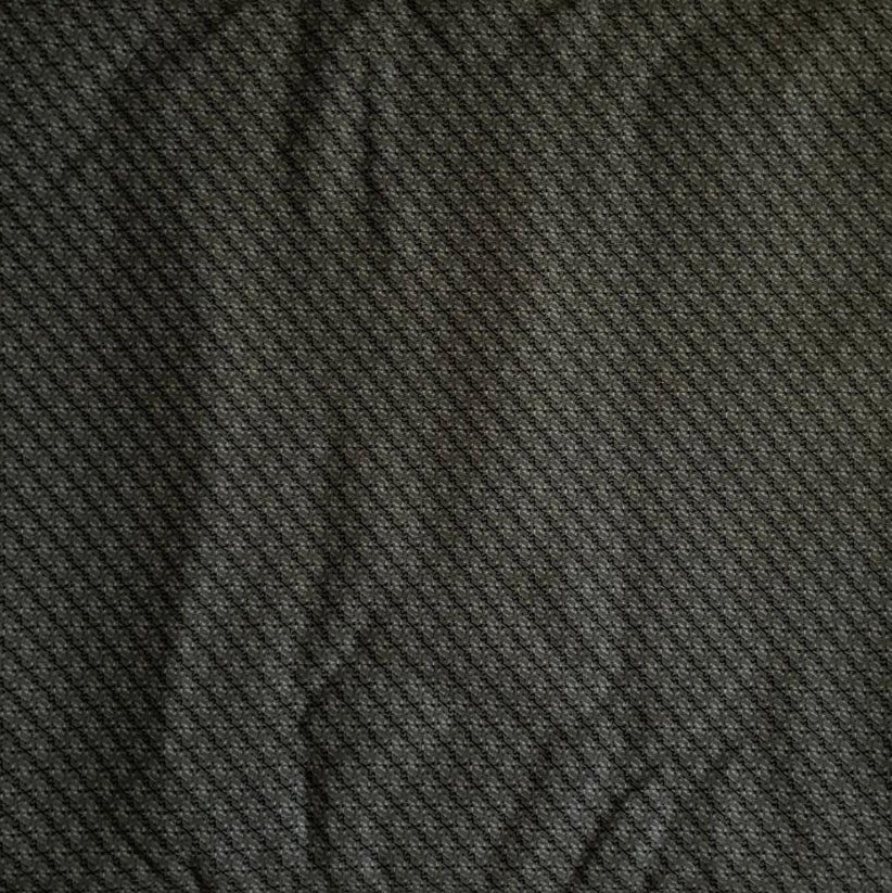 Folded Dark Green Micro Geometric Digital Print Cotton Fabric, showing a subtle repeating pattern, ideal for sustainable men's shirts, dresses, and elegant home decor.