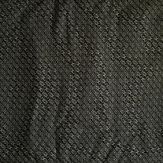 Folded Dark Green Micro Geometric Digital Print Cotton Fabric, showing a subtle repeating pattern, ideal for sustainable men's shirts, dresses, and elegant home decor.
