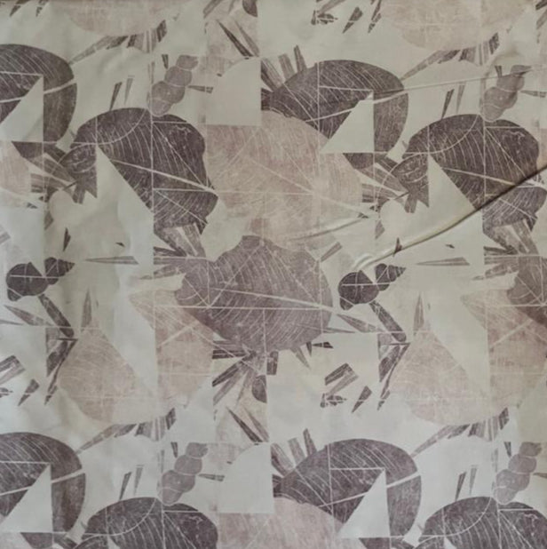 Folded Grey and Mauve Abstract Fragmented Digital Print Cotton Fabric, showing modern geometric shapes, ideal for sustainable dresses, men's shirts, and contemporary home decor.