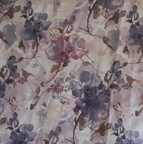 Folded Pastel Purple and Pink Floral Digital Print Cotton Fabric, showing soft blossoms, ideal for sustainable dresses, men's shirts, and romantic home decor.