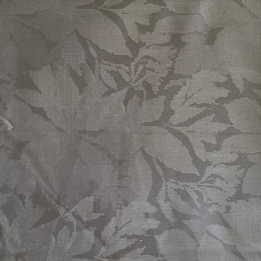 Folded Silver Grey Tone-on-Tone Botanical Digital Print Cotton Fabric, showing subtle leaf patterns, ideal for sustainable dresses, men's shirts, and elegant home decor.