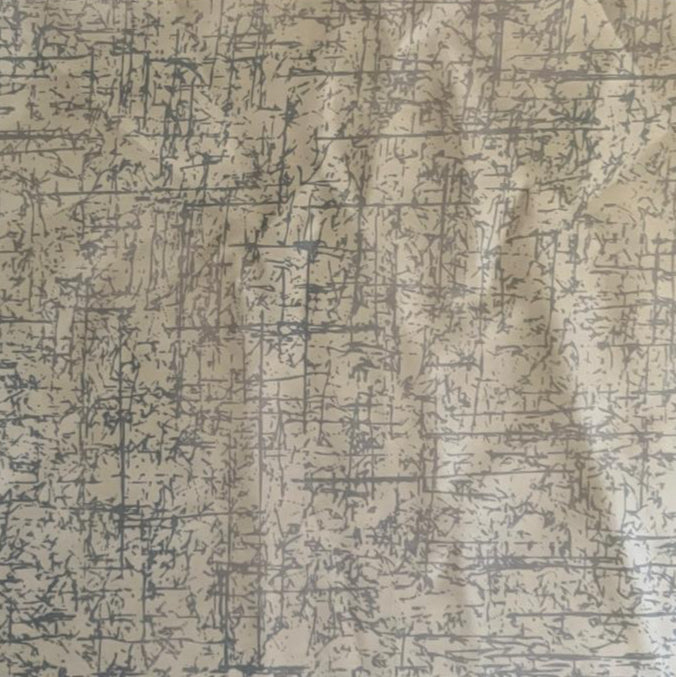 Folded White and Grey Abstract Line Digital Print Cotton Fabric, showing a distressed textured pattern, ideal for sustainable men's shirts, dresses, and modern home decor.